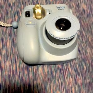 Blue instax camera about 3-4 inches